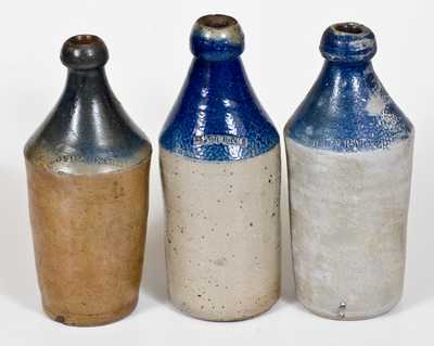 Lot of Three: Stoneware Bottles with Cobalt Tops and Impressed Advertising