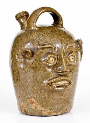 Extremely Rare and Important Edgefield, South Carolina, Stoneware Face Harvest Jug