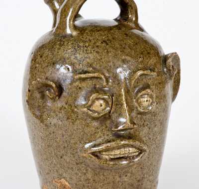Extremely Rare and Important Edgefield, South Carolina, Stoneware Face Harvest Jug