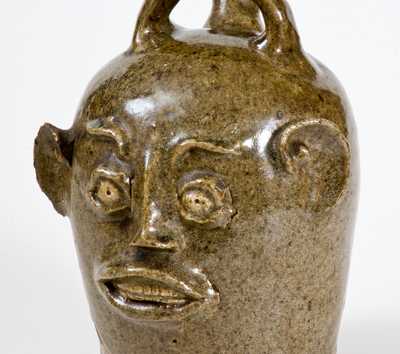 Extremely Rare and Important Edgefield, South Carolina, Stoneware Face Harvest Jug