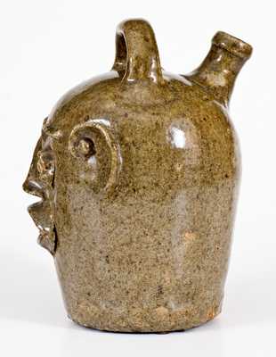 Extremely Rare and Important Edgefield, South Carolina, Stoneware Face Harvest Jug