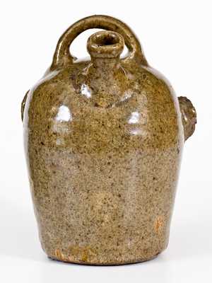 Extremely Rare and Important Edgefield, South Carolina, Stoneware Face Harvest Jug