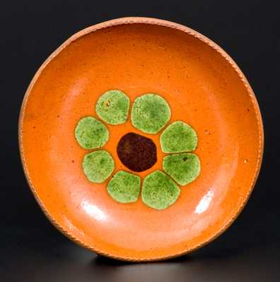 Very Fine Small Redware Plate with Two-Colored Slip Flower Decoration
