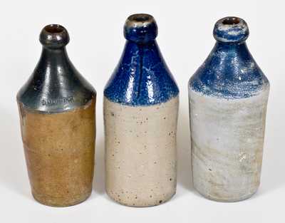 Lot of Three: Stoneware Bottles with Cobalt Tops and Impressed Advertising