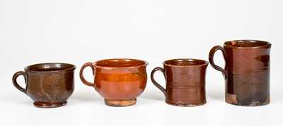 Four Glazed Redware Drinking Vessels, American, 19th century