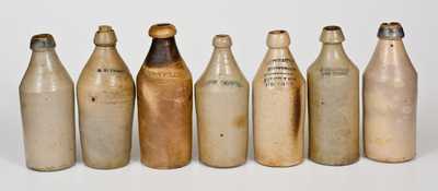 Lot of Seven: Stoneware Bottles incl. 5 with Impressed Advertising