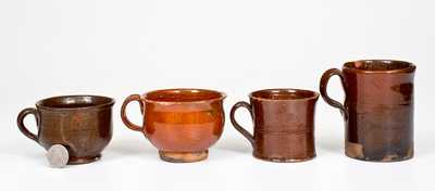 Four Glazed Redware Drinking Vessels, American, 19th century
