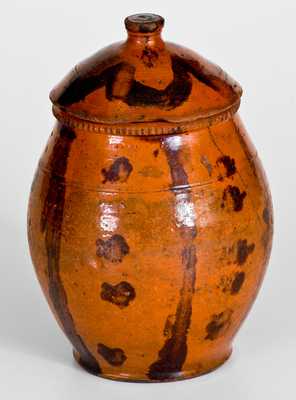 Scarce Lidded Redware Jar with Folky Decoration, probably Pennsylvania