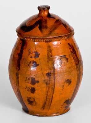 Scarce Lidded Redware Jar with Folky Decoration, probably Pennsylvania