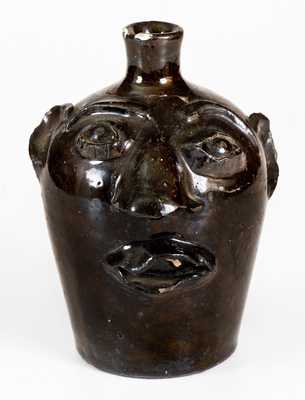 Albany-Slip-Glazed Stoneware Face Jug, Stamped