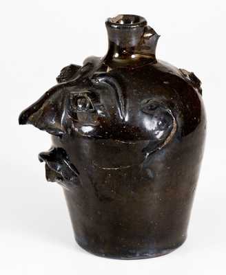 Albany-Slip-Glazed Stoneware Face Jug, Stamped