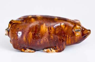 Very Rare Rockingham-Glazed Anna Pottery Pig Bottle