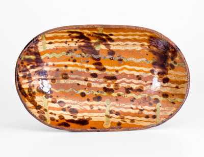 Very Fine Small-Sized Redware Loaf Dish with Three-Color Slip Decoration