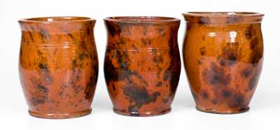 Lot of Three: Pennsylvania Redware Handled Jars with Manganese Decoration