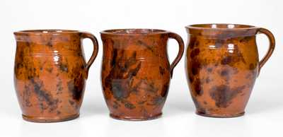 Lot of Three: Pennsylvania Redware Handled Jars with Manganese Decoration