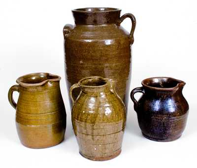 Lot of Four: Alkaline-Glazed Southern Stoneware incl. Three Pitchers and Reinhardt Bros. Churn