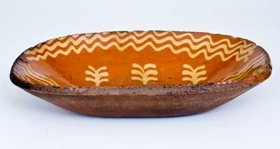 Fine Slip-Decorated Redware Loaf Dish, Philadelphia, PA origin, circa 1825