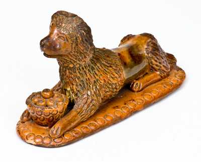 Rare and Important Redware Figure of a Dog with Basket, attrib. John Bell, Waynesboro, PA