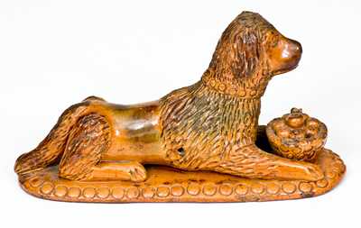 Rare and Important Redware Figure of a Dog with Basket, attrib. John Bell, Waynesboro, PA