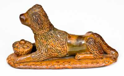 Rare and Important Redware Figure of a Dog with Basket, attrib. John Bell, Waynesboro, PA