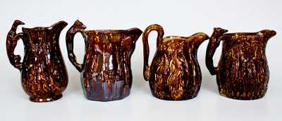 Lot of Four: Rockingham Ware Pitchers with Hanging Game Designs