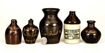 Lot of Five: Miniature Albany-Slip Stoneware Advertising Jugs with Urn