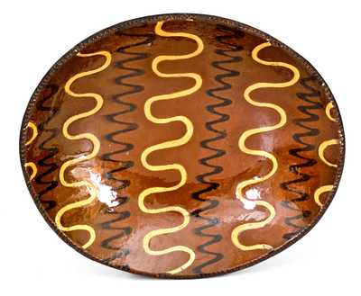 Outstanding Redware Platter with Profuse Yellow and Black Slip Decoration