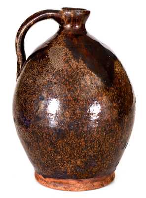 Ovoid New England Redware Jug with Manganese Glaze