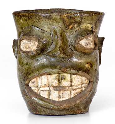 Important Alkaline-Glazed Stoneware Face Cup, Edgefield District, SC origin, circa 1855-1870