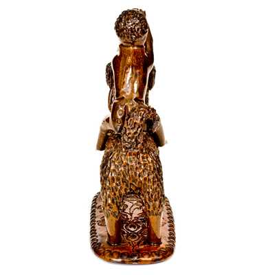 Exceptional Large-Sized Pennsylvania Redware Figure of a Dog with Monkey Rider