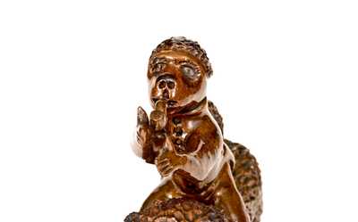 Exceptional Large-Sized Pennsylvania Redware Figure of a Dog with Monkey Rider