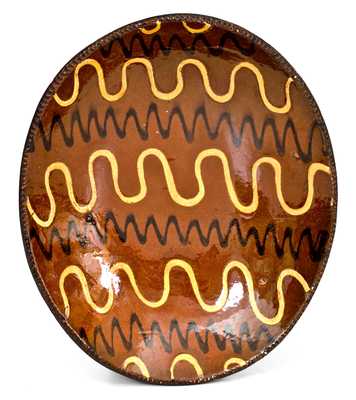 Outstanding Redware Platter with Profuse Yellow and Black Slip Decoration