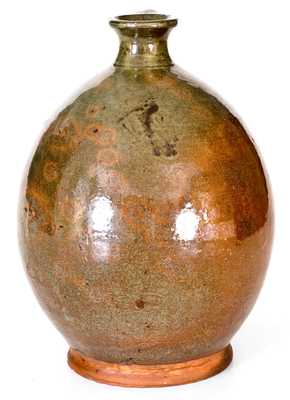 Exceptional Ovoid New England Redware Jug with Vibrant Glaze