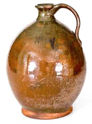 Exceptional Ovoid New England Redware Jug with Vibrant Glaze