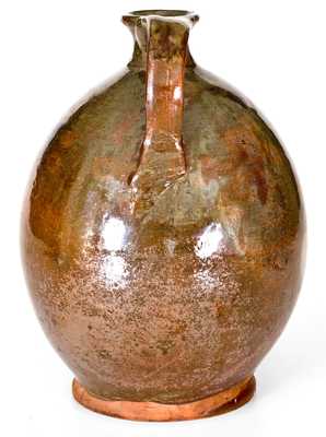 Exceptional Ovoid New England Redware Jug with Vibrant Glaze