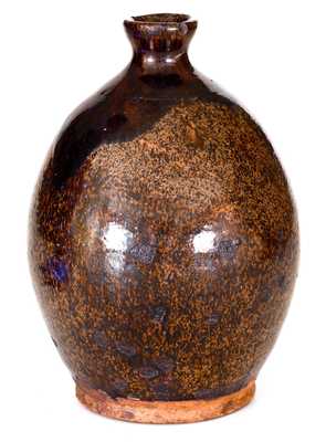 Ovoid New England Redware Jug with Manganese Glaze