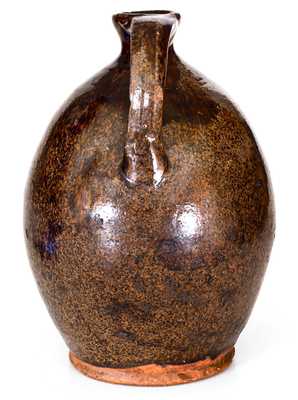 Ovoid New England Redware Jug with Manganese Glaze