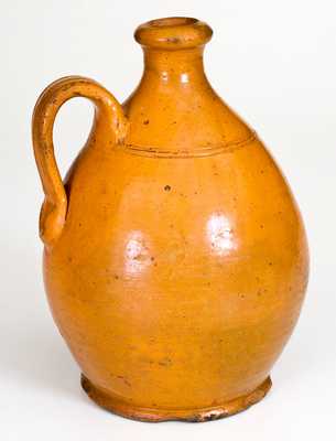 American Redware Jug with Bright Orange Glaze