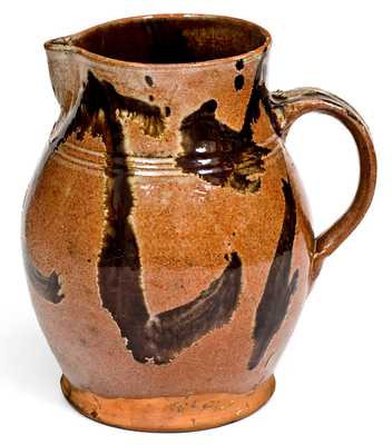 Rare and Important Slip-Decorated New England Redware Pitcher