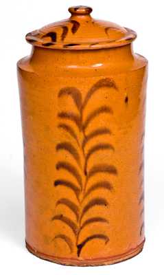 Rare and Important Slip-Decorated New England Redware Jar with Lid