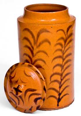 Rare and Important Slip-Decorated New England Redware Jar with Lid