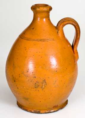 American Redware Jug with Bright Orange Glaze