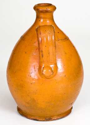 American Redware Jug with Bright Orange Glaze