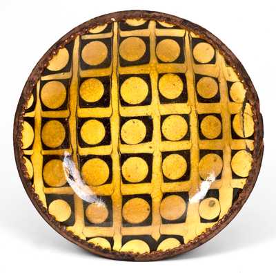 Exceptional Slip-Decorated Redware Plate, English origin, probably 18th century