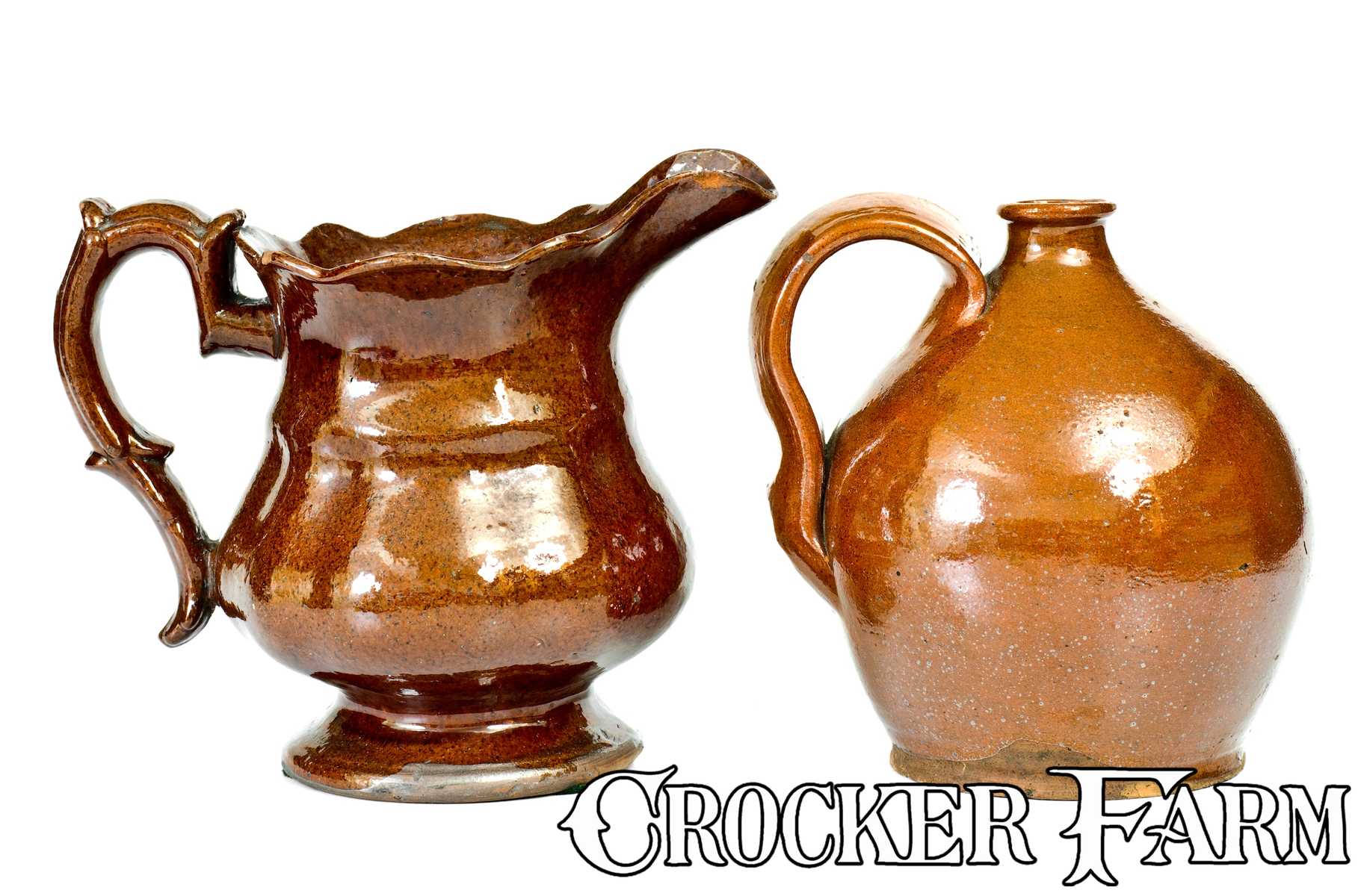 Lot of Two: Molded Pennsylvania Redware Pitcher and Ovoid Redware Jug ...