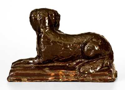 Stoneware Reclining Dog Doorstop, Jane Lew, WV, circa 1880, Dark-Brown Glaze