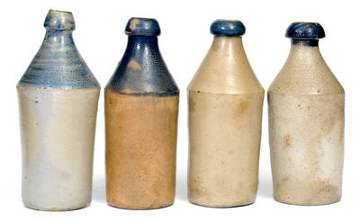 Lot of Four: Stoneware Bottles with Cobalt Tops