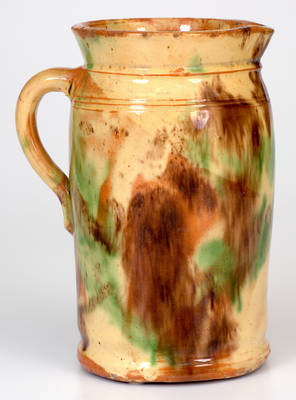 Fine Shenandoah Valley Multi-Glazed Redware Tankard Pitcher, attributed to S. Bell & Sons, Strasburg, VA, circa 1890.