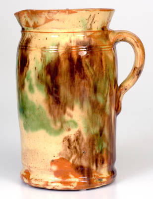 Fine Shenandoah Valley Multi-Glazed Redware Tankard Pitcher, attributed to S. Bell & Sons, Strasburg, VA, circa 1890.