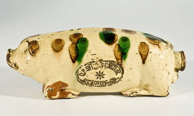 Extremely Rare Slip-Decorated Redware Pig Bottle, Stamped D.P. SHENFELDER / READING, PA, circa 1870.